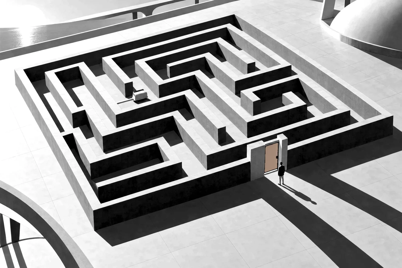 A stone labyrinth seen from above with a small cart finding its way through, and a person standing at its one gate, which has a blue door